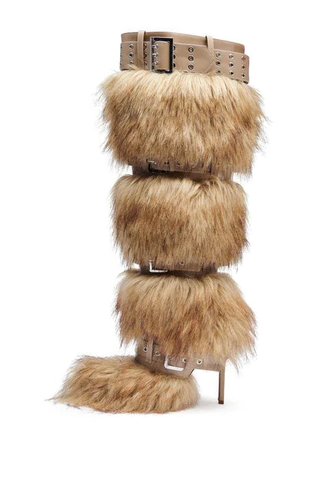 Furry boot with multiple buckles on a white background