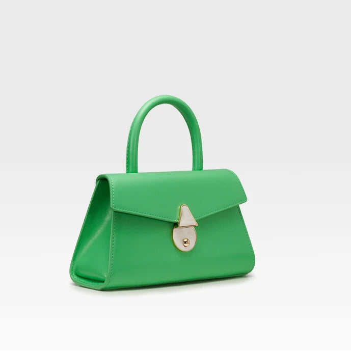 Green handbag with a gold lock on a light gray background, featuring the brand 'Bafelli'.