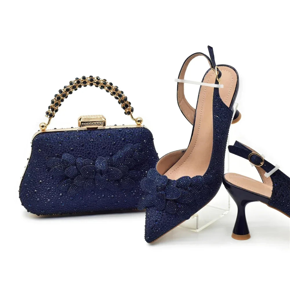 Navy blue glittery handbag and high-heeled shoes with bow details on a white background
