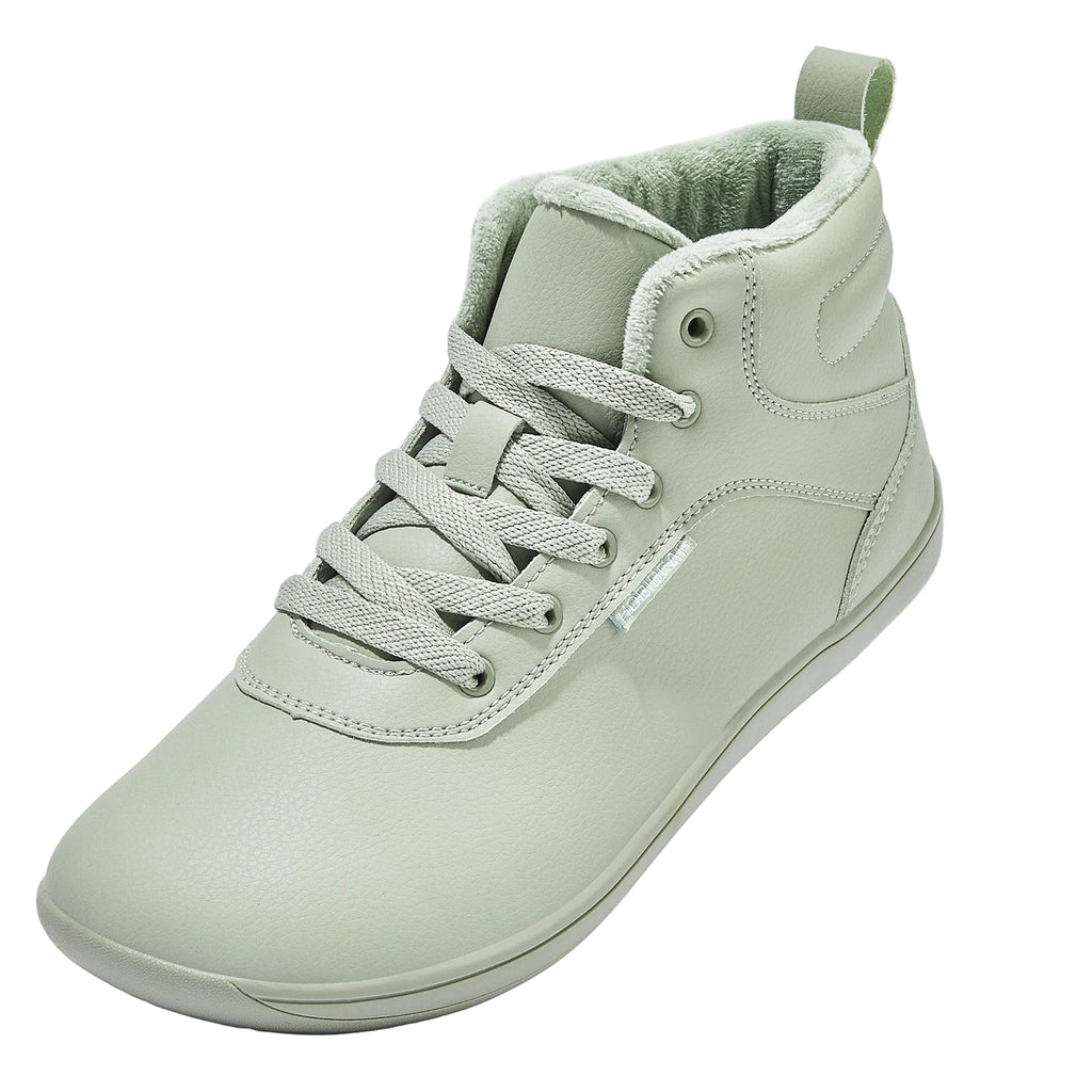 Light green sneaker with lace-up design on a white background